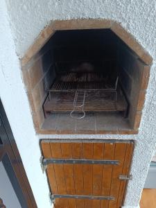 a wooden chest in a building with a wall at Los Angeles in Roses +18 photos