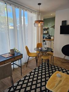 a living room with a table and chairs at 205 Serenity in Cascais