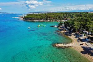an aerial view of a beach with boats in the water at Camping Park Soline Pitches in Biograd na Moru