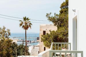 a view of the ocean from the balcony of a house at Kastro boutique apartment in Naxos Chora +32 photos