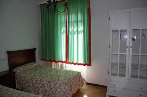 Postel nebo postele na pokoji v ubytování Fantástico chalet en Sevilla