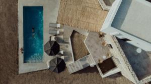 an overhead view of a swimming pool with umbrellas at Villa Andalusia in Naxos Chora