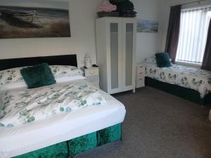 Postel nebo postele na pokoji v ubytování Elysian Fields B&B