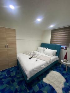 a bedroom with a bed with a cross on it at VILA JAHORINSKI RAJ A5 in Jahorina