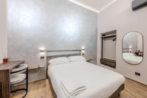 Postel nebo postele na pokoji v ubytování Soziglia Guest Rooms