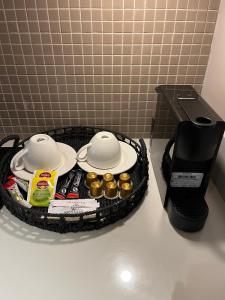a tray with two dishes and a coffee maker on a counter at Weingart Suites Hotel in Istanbul