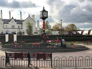 a clock tower in the middle of a park at Captivating 1-Bed Apartment in Hednesford in Cannock