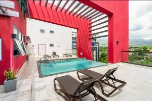 a swimming pool on the roof of a building at Airy Modern 2br Condo Rooftop Pool in Kingston