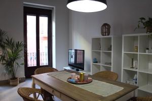 Televízia a/alebo spoločenská miestnosť v ubytovaní LovelyLoft Castaños