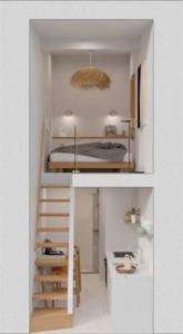 a small room with a bed and a staircase at LovelyLoft Santa Cruz in Alicante