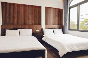 Postel nebo postele na pokoji v ubytování Vĩnh Tuấn Hotel