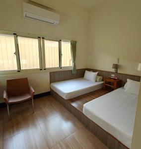 Postel nebo postele na pokoji v ubytování Li Yuan Homestay