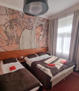 Postel nebo postele na pokoji v ubytování Hotel Klara