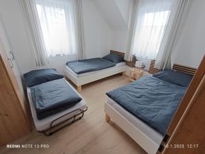 Postel nebo postele na pokoji v ubytování Apartmány Zdíkov