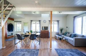 a living room with a couch and a table at Guest House Porvoo in Porvoo