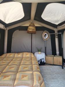 a bedroom with a bed in a tent at Ecoclub in Varna City