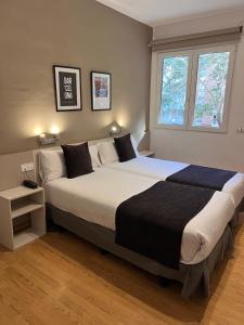 Posteľ alebo postele v izbe v ubytovaní Hotel Travessera