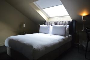 Postel nebo postele na pokoji v ubytování B+B Edinburgh