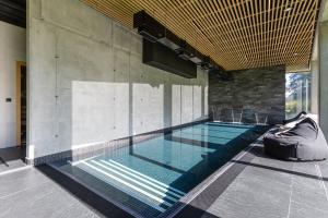 a swimming pool in the middle of a building at XYZ eXtreme You Zen in Szczyrk
