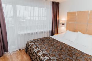 Postel nebo postele na pokoji v ubytování Pärnu Hotel