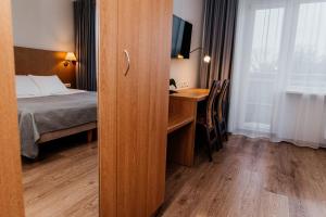 Postel nebo postele na pokoji v ubytování Pärnu Hotel