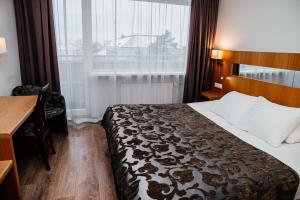 Postel nebo postele na pokoji v ubytování Pärnu Hotel