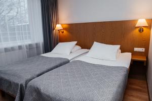 Postel nebo postele na pokoji v ubytování Pärnu Hotel