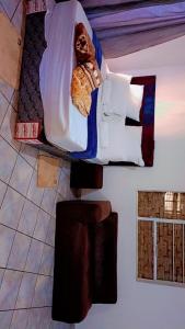 Ένα ή περισσότερα κρεβάτια σε δωμάτιο στο BATO Accommodation