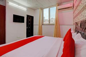 Postel nebo postele na pokoji v ubytování Hotel O Royal Dream + 17 fotografií