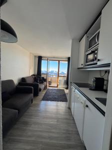 Kuchyň nebo kuchyňský kout v ubytování Logement Avoriaz T2 vue magnifique La Falaise