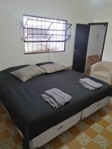 Giường trong phòng chung tại ESTANCIA VILLA FLOR - CASA DE CAMPO-