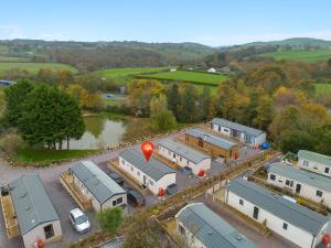 an aerial view of a parking lot with trailers at Lake View Holiday Home - Fishing Lakes, Heated Outdoor Swimming Pool 500yrds on Sister Park, Pool Shut for the winter open April 2026 in Exeter
