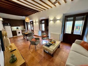 a living room with a couch and a table at G5 Realejo apartment in Granada