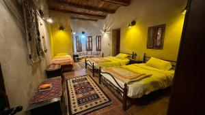 En eller flere senge i et værelse på Paloma Lodge Guest House