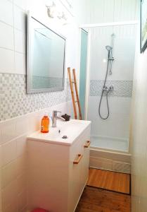 a white bathroom with a sink and a shower at Maison bohème chic Valençay in Valençay +27 photos