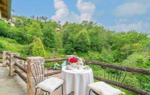 a table and chairs on a balcony with a view at Villa Nicoletta in Garlenda