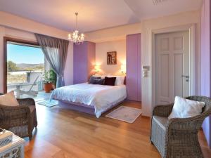 A bed or beds in a room at Armonia Luxury Villa Még 37 kép