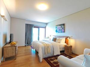 A bed or beds in a room at Armonia Luxury Villa