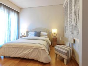 A bed or beds in a room at Armonia Luxury Villa