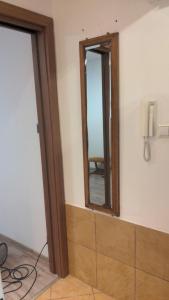 a room with a mirror on the wall at Mała dziupla in Opole