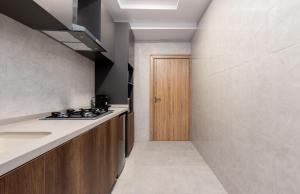 Kuchyň nebo kuchyňský kout v ubytování STP Apartments