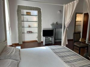 Posteľ alebo postele v izbe v ubytovaní Sant'Ambrogio Suite