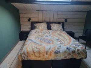 Postel nebo postele na pokoji v ubytování vakantiehuis en appartement De Harscamp