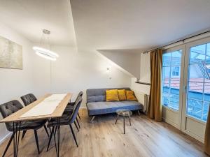 a living room with a couch and a table at Apartment Frank-2 by Interhome in Feldkirchen in Kärnten +24 photos