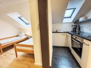 a kitchen with a sink and a stove top oven at Apartment Frank-2 by Interhome in Feldkirchen in Kärnten