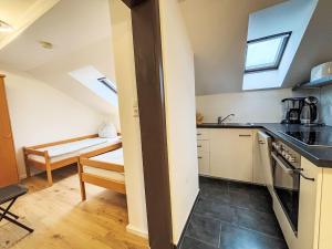 a kitchen with a sink and a stove top oven at Apartment Frank-2 by Interhome in Feldkirchen in Kärnten