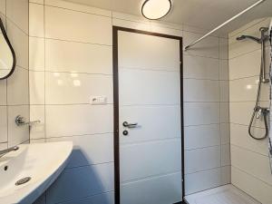 a shower with a glass door in a bathroom at Apartment Frank-2 by Interhome in Feldkirchen in Kärnten