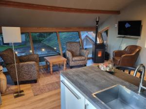 Posezení v ubytování vakantiehuis en appartement De Harscamp