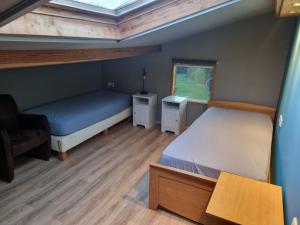 Postel nebo postele na pokoji v ubytování vakantiehuis en appartement De Harscamp