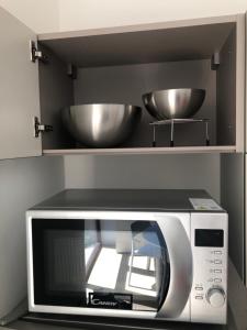 A kitchen or kitchenette at Music House - Carozzi Apartments